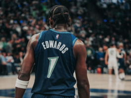 Picture of Minnesota Timberwolves guard Anthony Edwards from behind, capturing his jersey number and name as he looks down the court